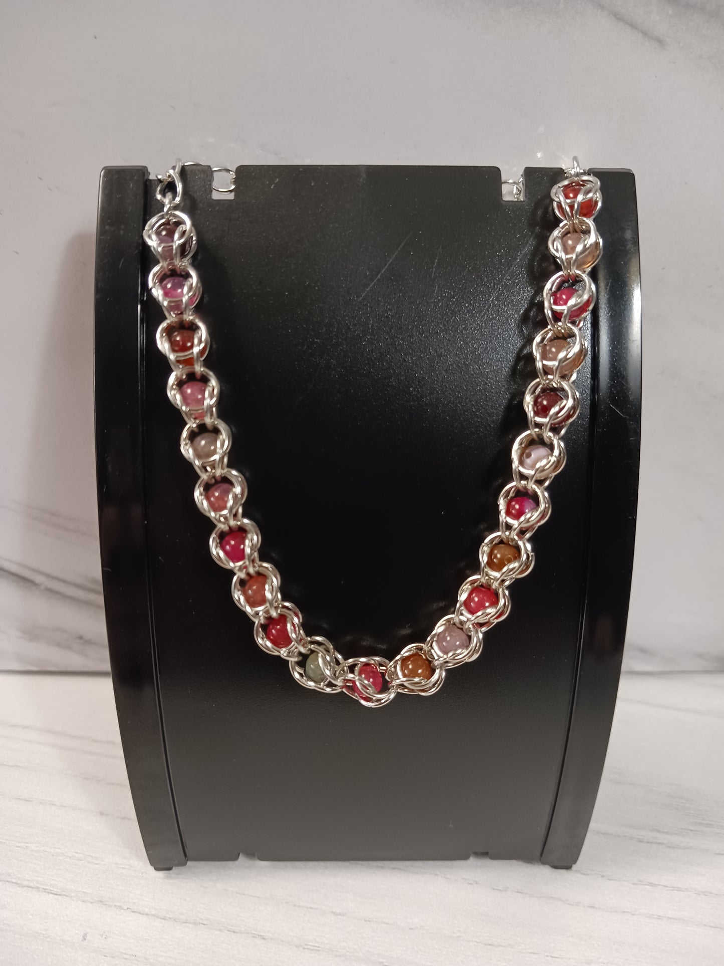Pink/Red Toned Quartz Captured Bead Bracelet