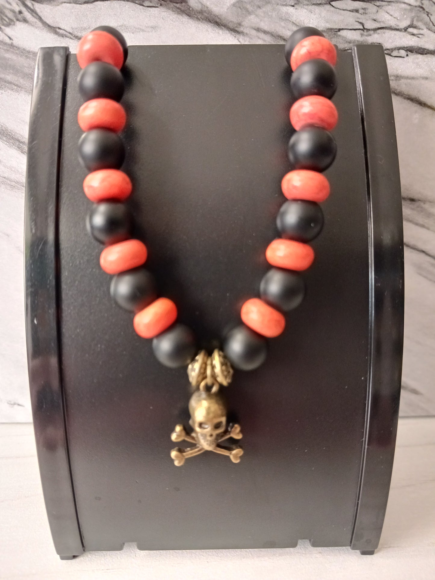 Black Onyx/Orange Glass/Bronze Skull Crossbones Bracelet