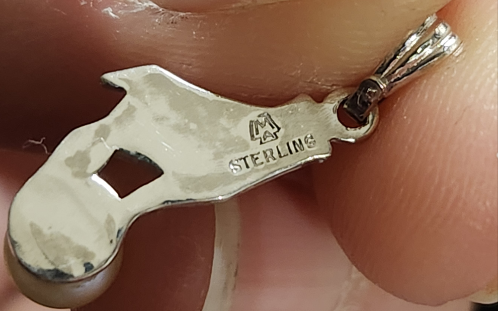 Sterling Silver Hand Holding a Pearl